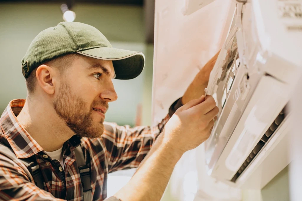 repairman-doing-air-conditioner-service.jpg