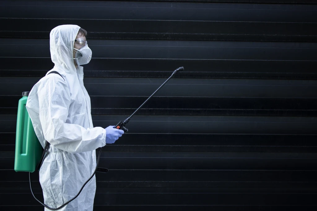 person-white-chemical-protection-suit-holding-sprayer-with-disinfectant-chemicals-stop-spreading-highly-contagious-virus.jpg